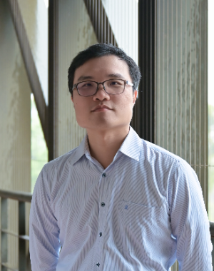 Chun-Ming Lai wearing a shirt, photographed in a hallway